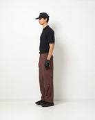AllCourse Pant in Plum — three-quarter view